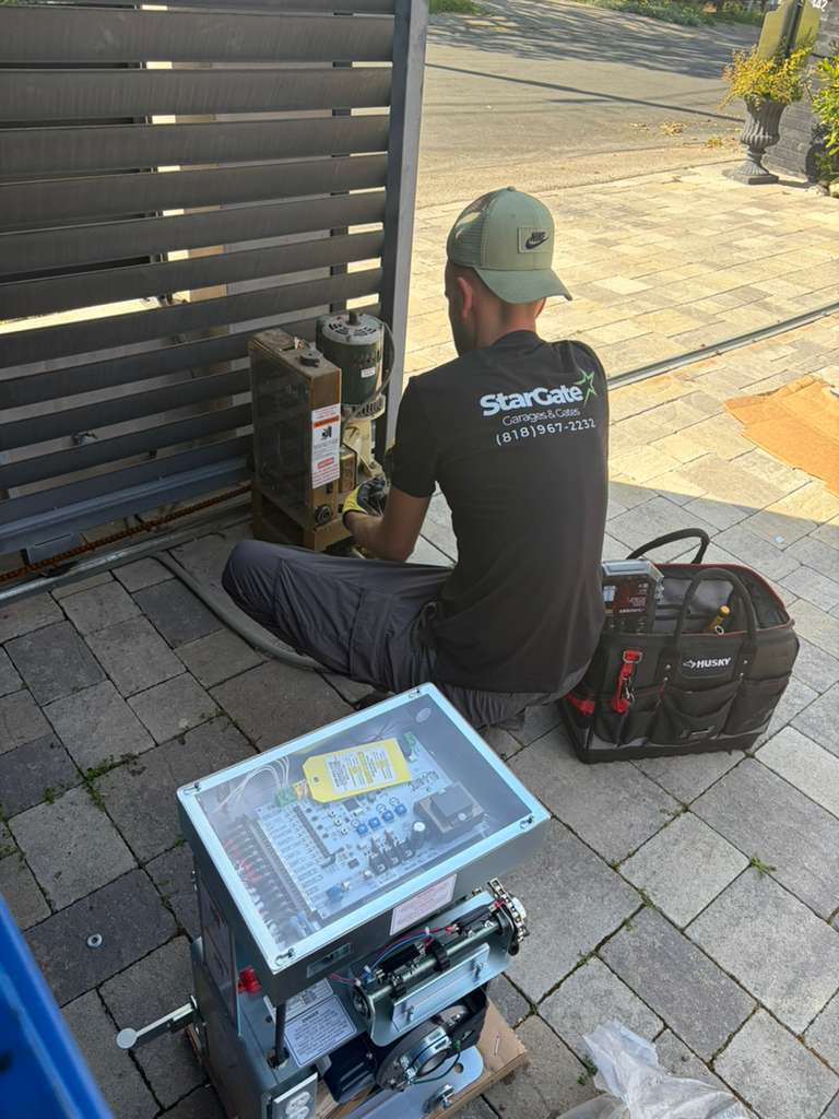 StarGate technician repairing electric gate in Los Angeles